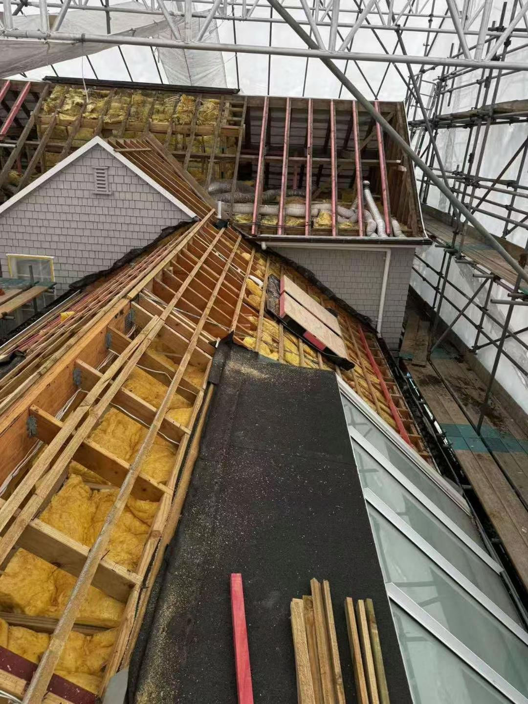 Old roof removed and framing exposed