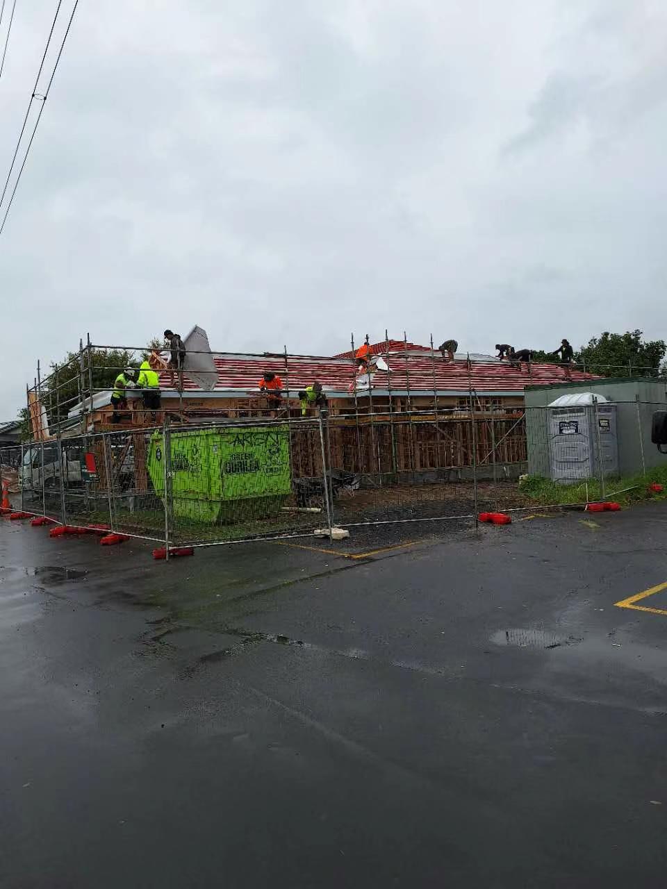 Roofing team working across the extension